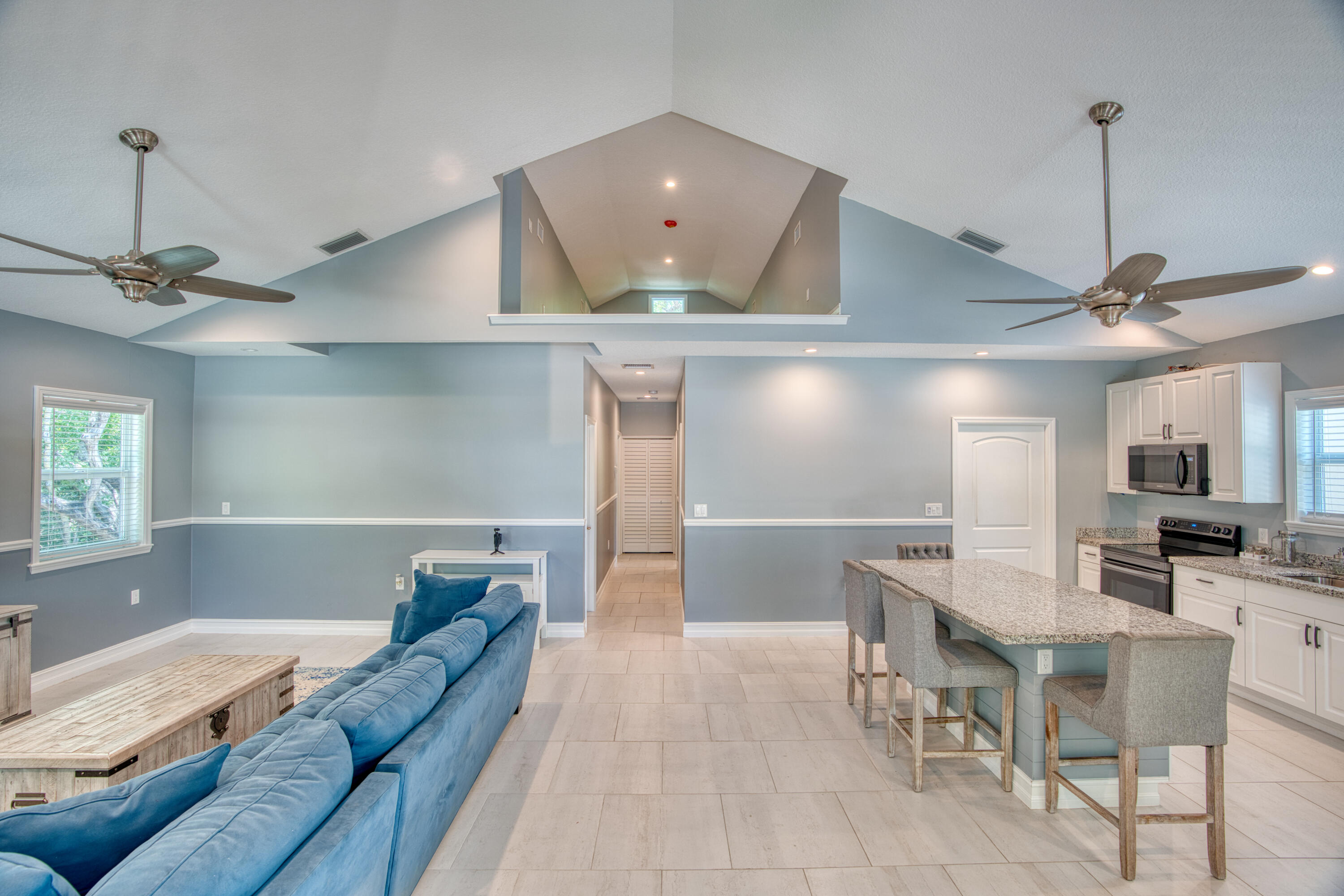 499 Beach Road Tavernier, FL 33070 - Photo 10 of 53 a living room with furniture and a window
