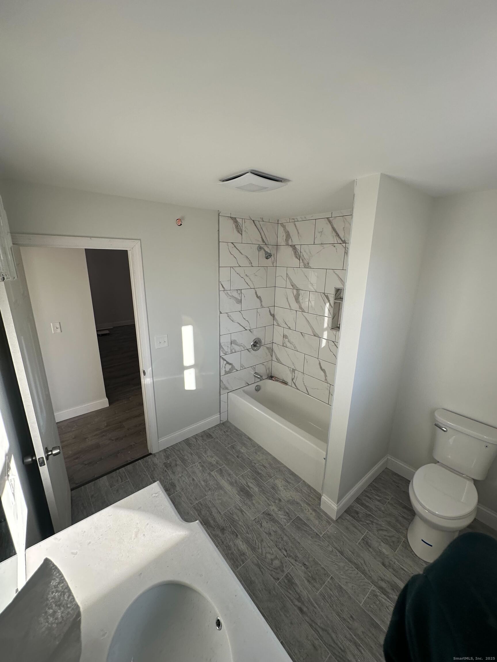 1085 Whalley Avenue, Unit 11 New Haven, CT 06515 - Photo 13 of 17 a bedroom with a bed and a window