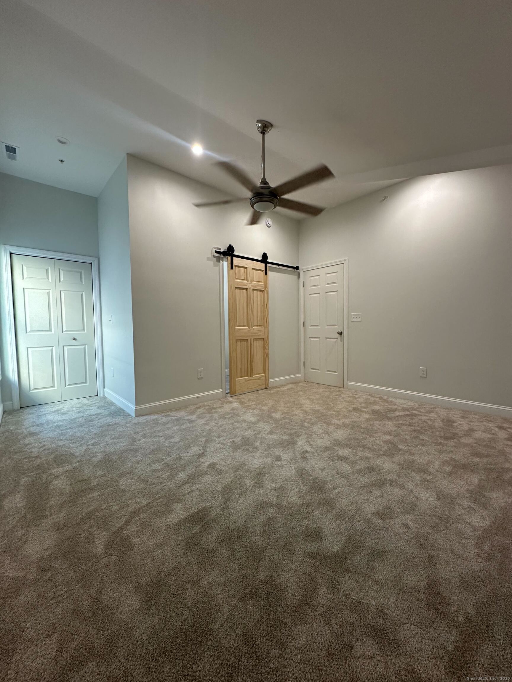 1085 Whalley Avenue, Unit 11 New Haven, CT 06515 - Photo 8 of 17 a view of a livingroom with a ceiling fan window and a ceiling fan