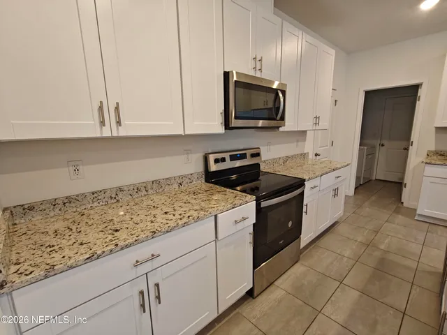 a house with trees in the background