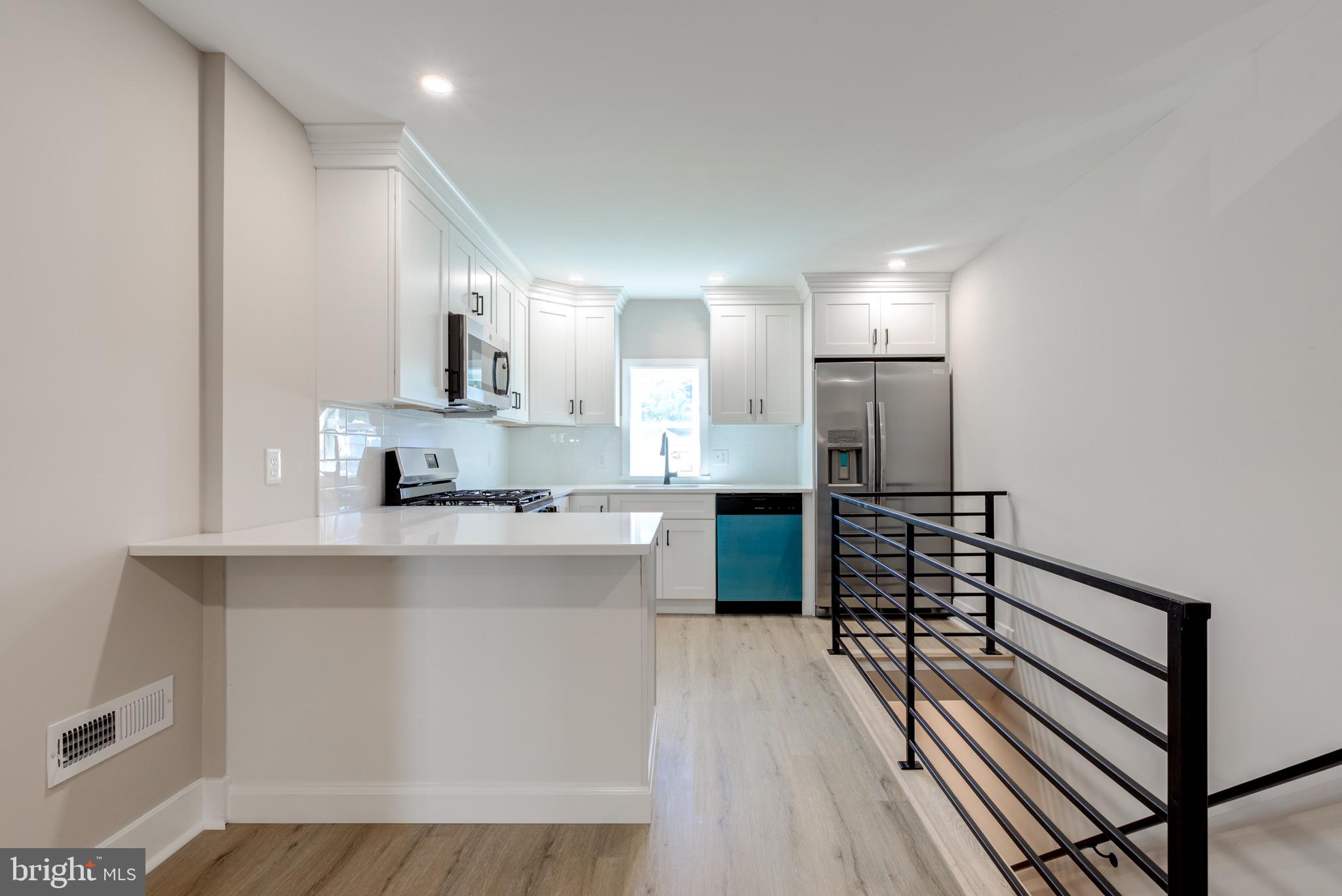 369 East Hector Street Conshohocken, PA 19428 - Photo 12 of 44 a kitchen with stainless steel appliances a sink stove and cabinets