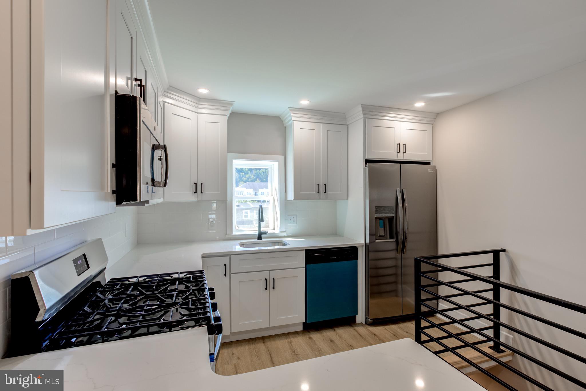 369 East Hector Street Conshohocken, PA 19428 - Photo 14 of 44 a kitchen with stainless steel appliances granite countertop a refrigerator and a sink