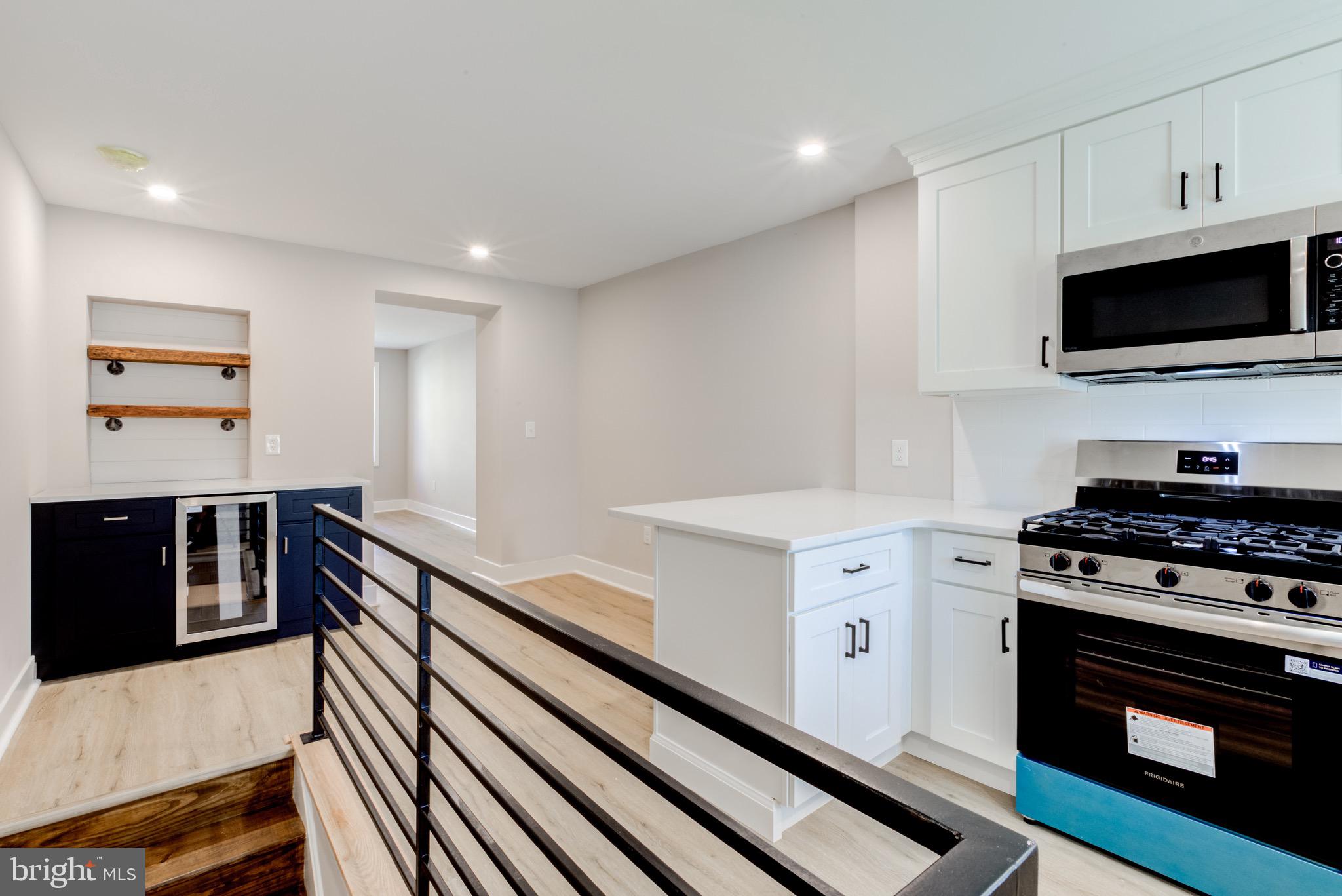 369 East Hector Street Conshohocken, PA 19428 - Photo 16 of 44 a kitchen with stainless steel appliances a stove microwave and cabinets