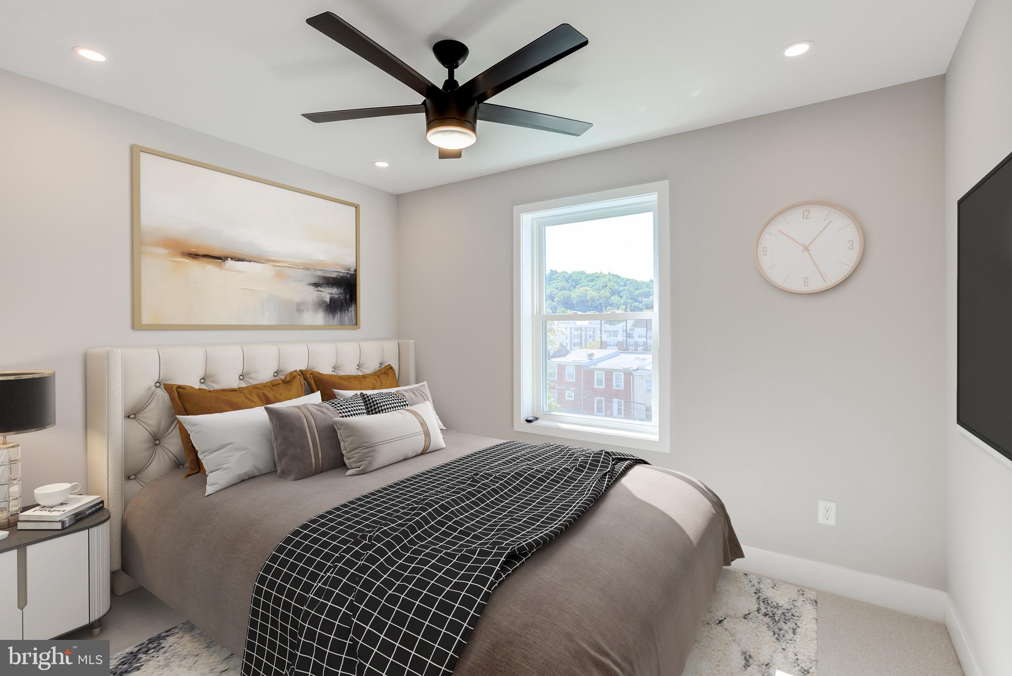 369 East Hector Street Conshohocken, PA 19428 - Photo 24 of 44 a bedroom with a large bed and a painting on the wall