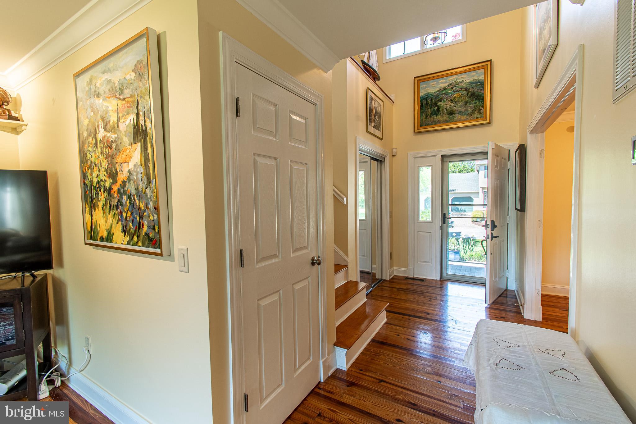 102 Jacks Point Road Oxford, MD 21654 - Photo 29 of 83 a view of a hallway with wooden floor and windows