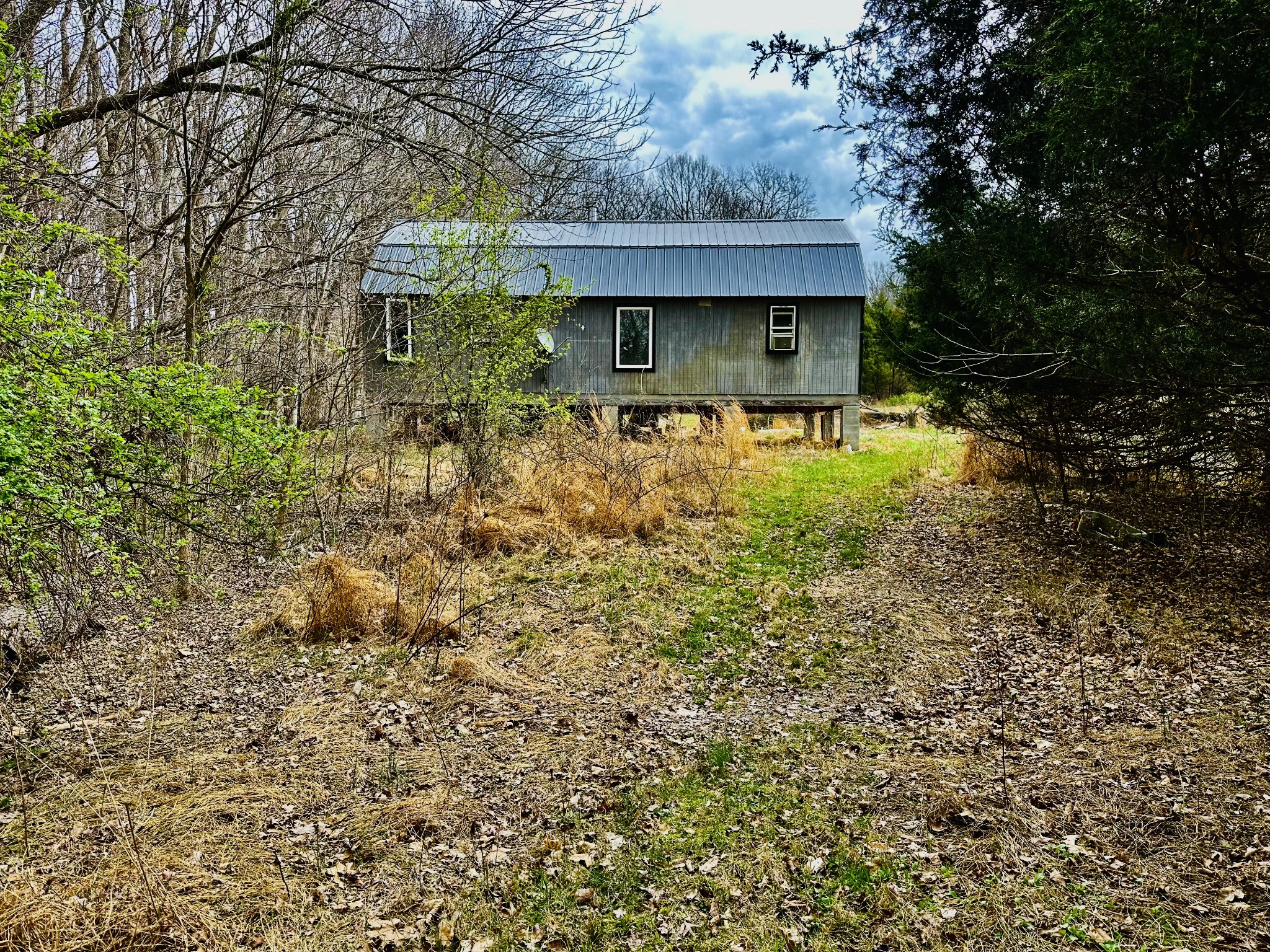 401 North Jones Road Portland, TN 37148 - Photo 16 of 25 a view of a house with a yard