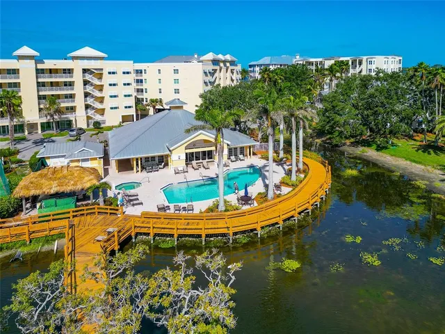 a swimming pool with outdoor seating and yard