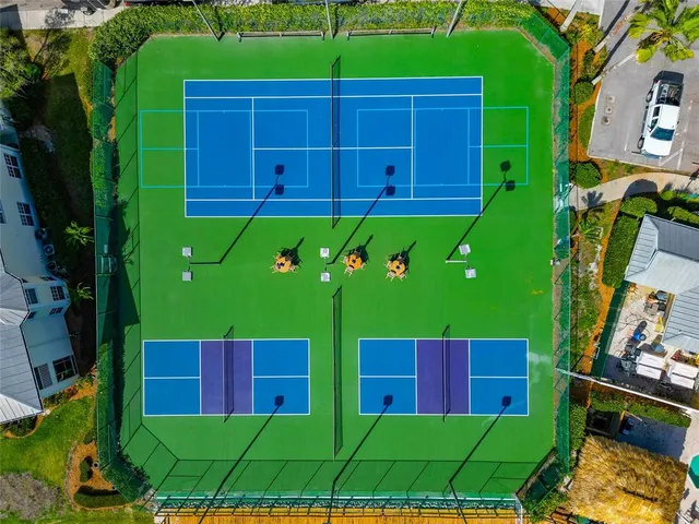 a view of a two chairs and a table in the backyard