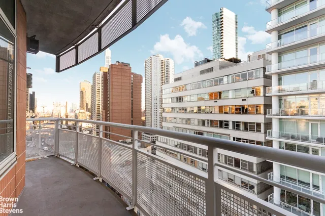 a view of balcony with outdoor seating and city view