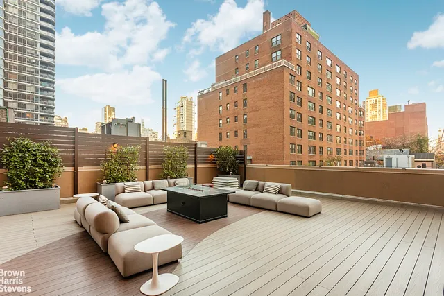 a bathroom with a toilet sink a mirror and vanity