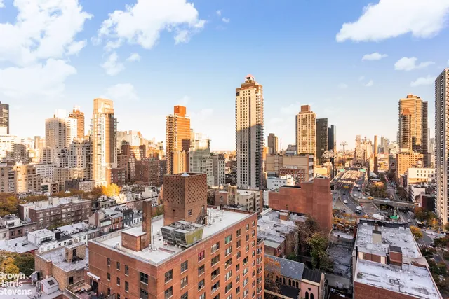 a living room with lots of furniture and a chandelier