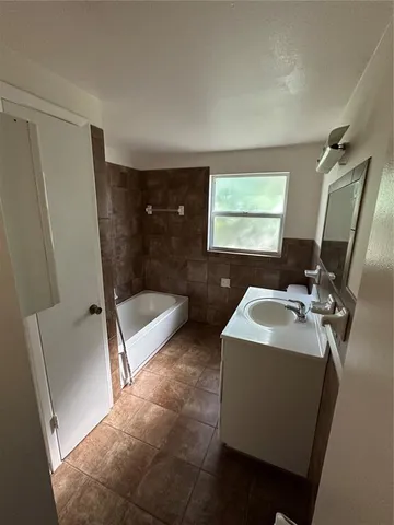 a bathroom with sink and mirror