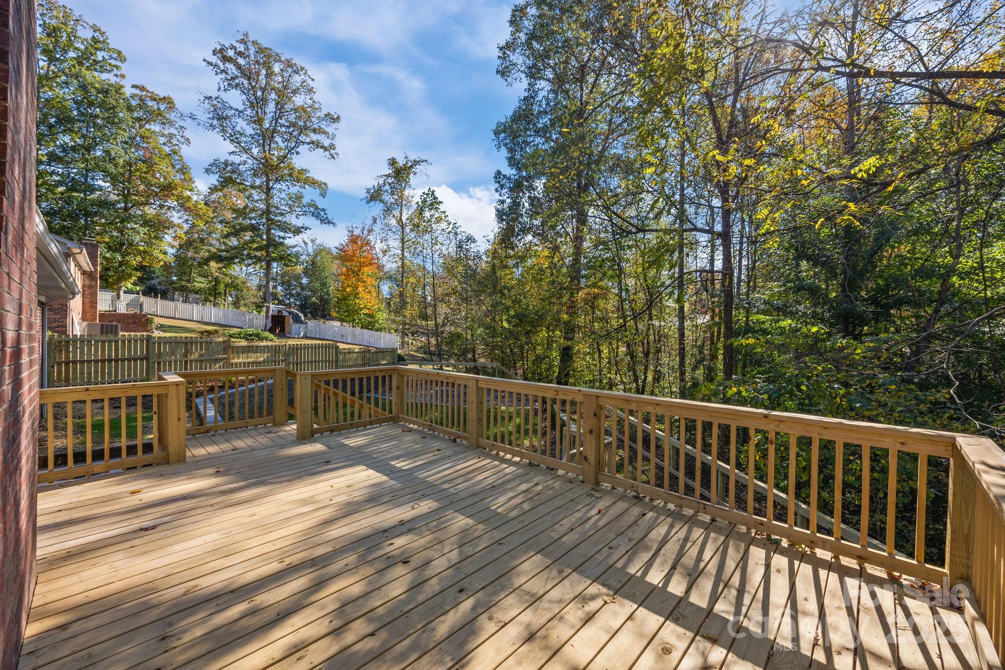 385 Pine Valley Road Salisbury, NC 28147 - Photo 11 of 35 a view of a balcony with wooden floor and fence