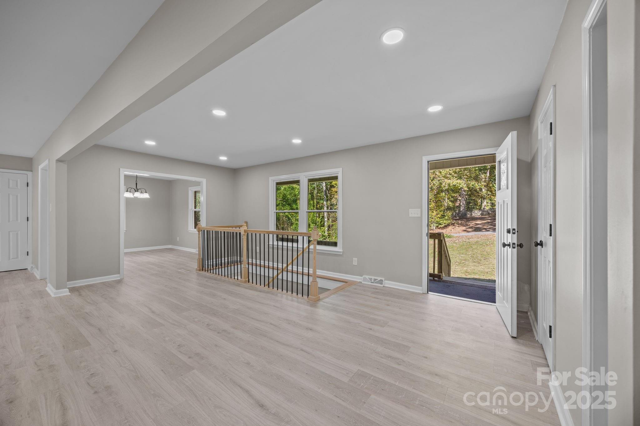 385 Pine Valley Road Salisbury, NC 28147 - Photo 17 of 35 an empty room with wooden floor and windows