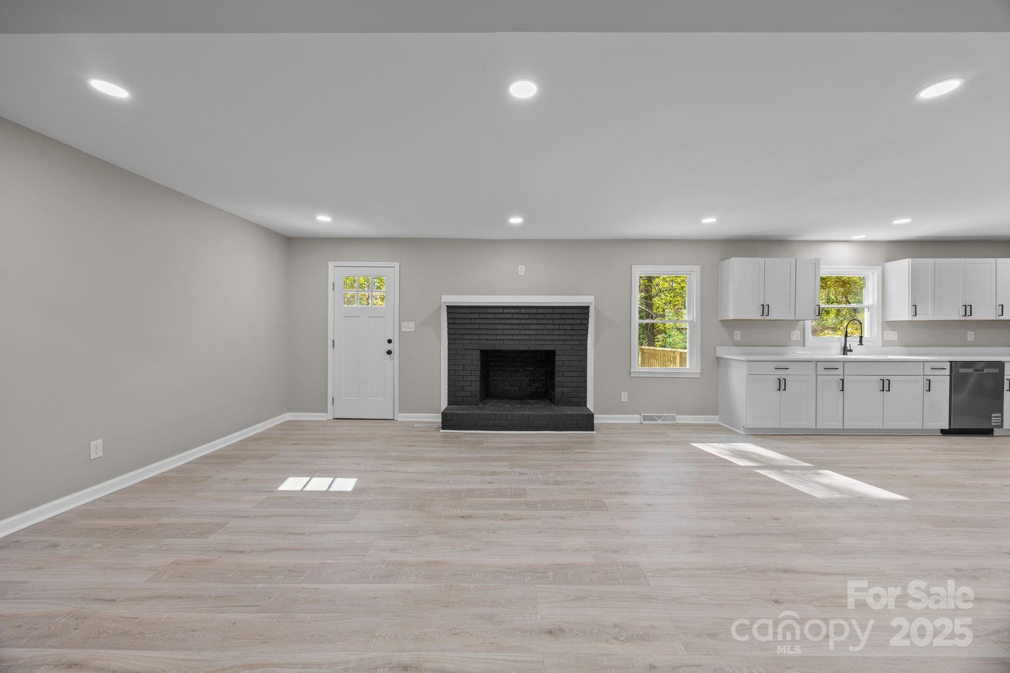 385 Pine Valley Road Salisbury, NC 28147 - Photo 19 of 35 a view of an empty room with a fireplace and a window