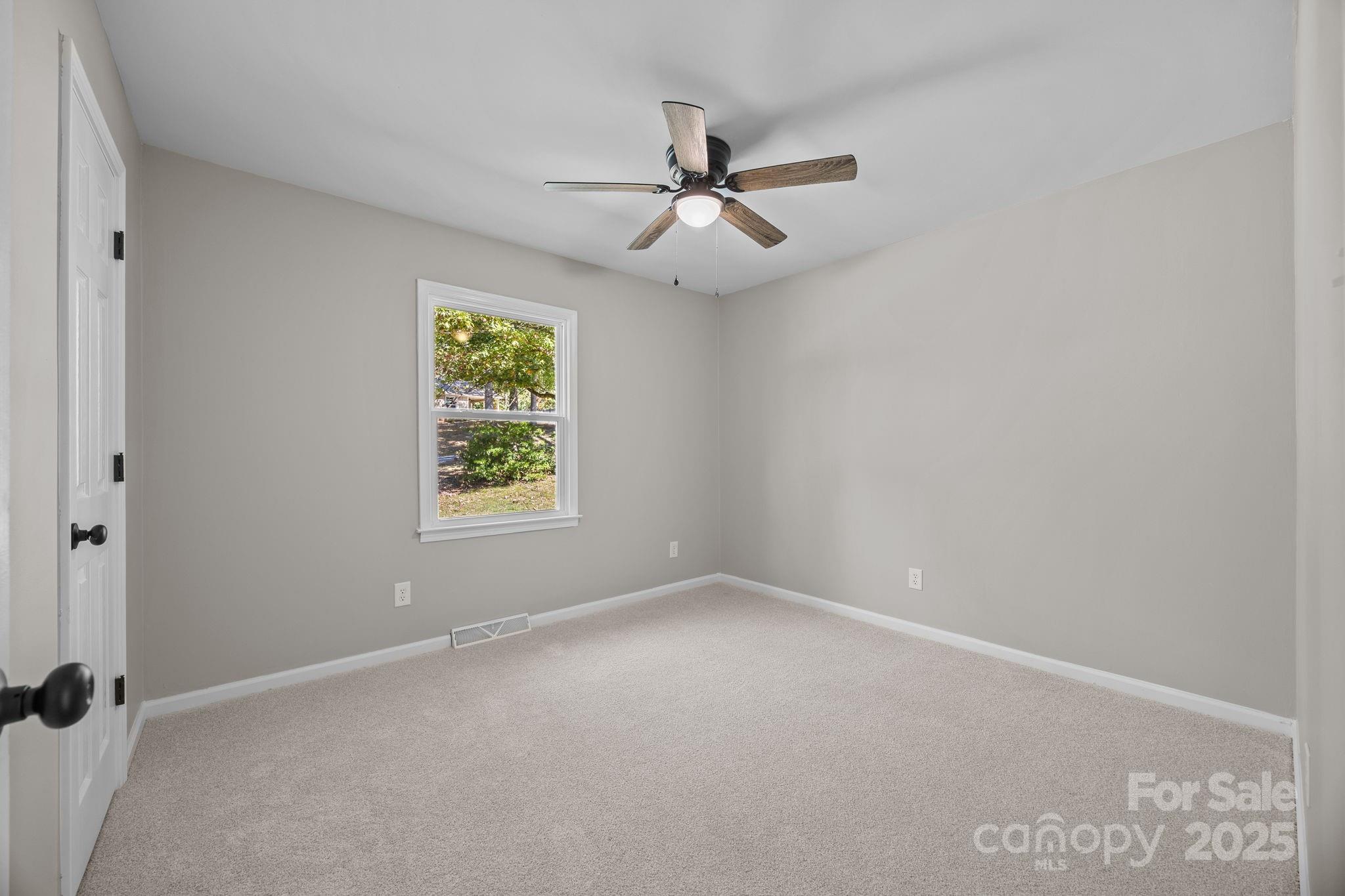 385 Pine Valley Road Salisbury, NC 28147 - Photo 25 of 35 an empty room with windows and fan