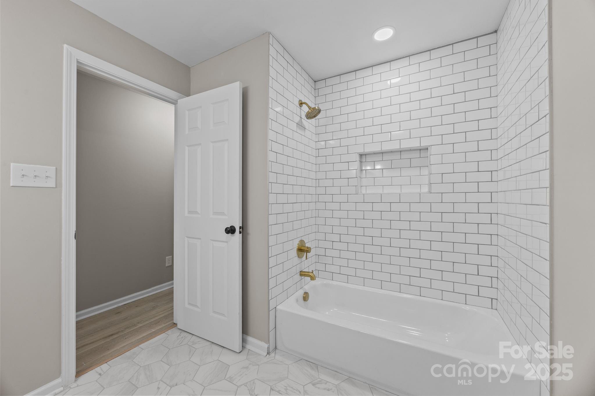 385 Pine Valley Road Salisbury, NC 28147 - Photo 27 of 35 a bathroom with a bathtub and a shower