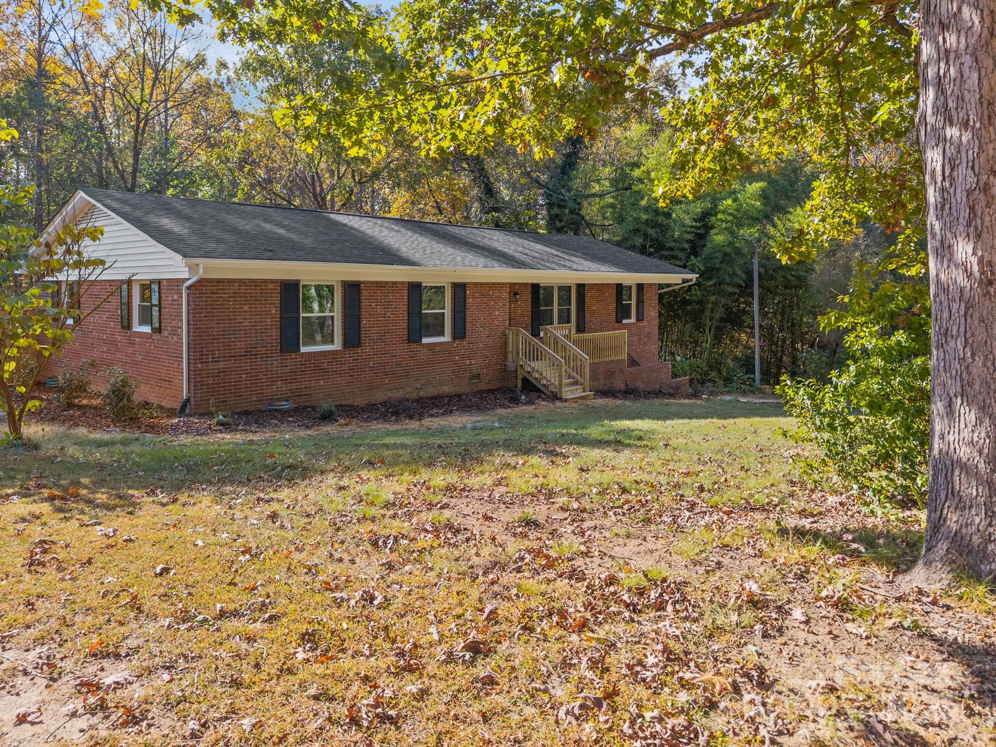385 Pine Valley Road Salisbury, NC 28147 - Photo 4 of 35 a house that has a tree in front of it