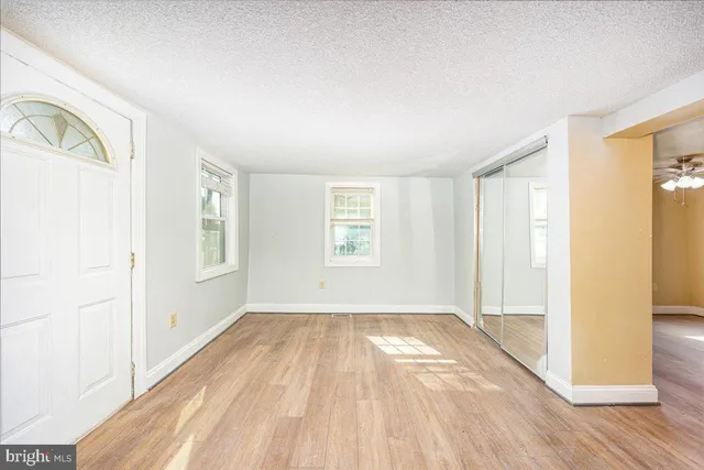 a view of an empty room and window