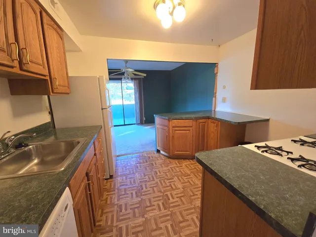 a kitchen with cabinets and stainless steel appliances