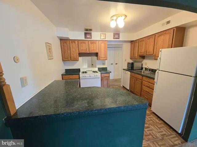 a view of a storage & utility room with a sink