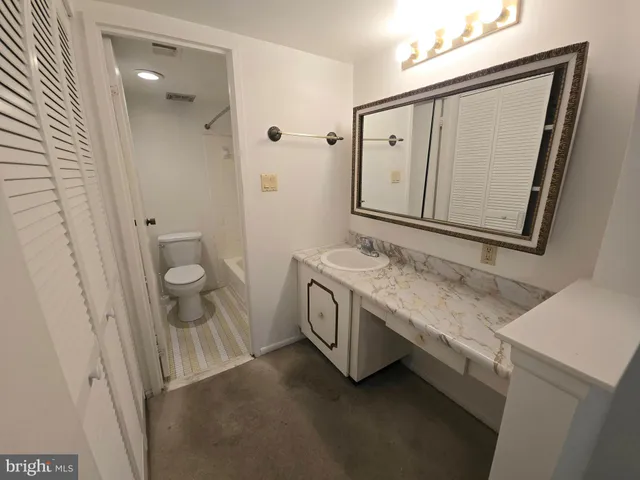 a view of an empty room with a fan