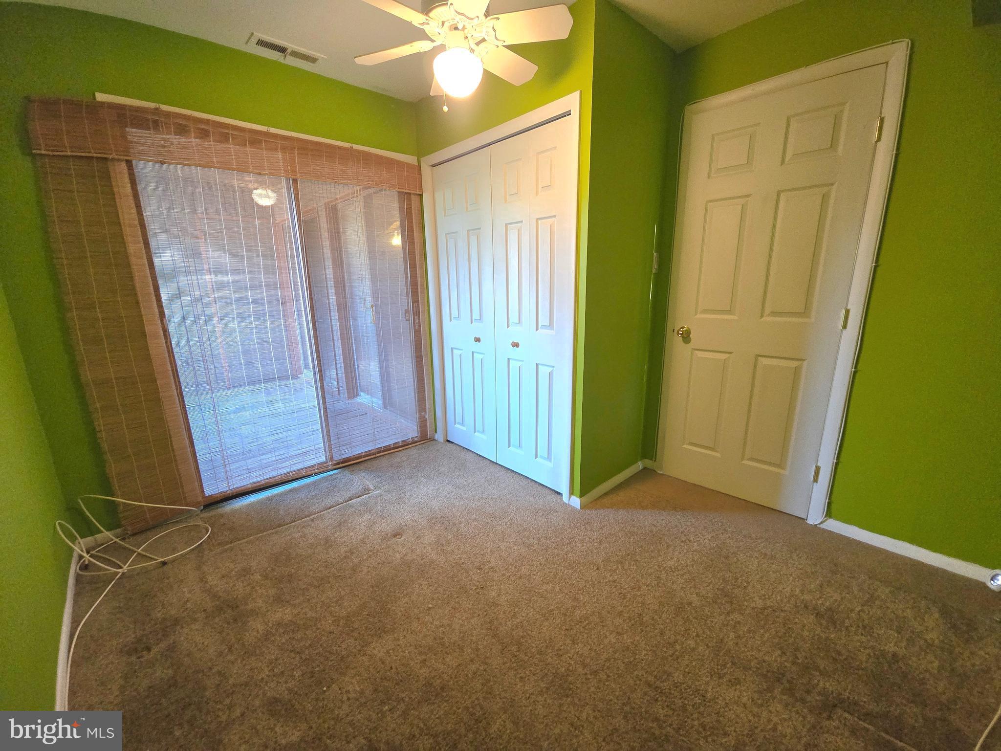 5026 North Convent Lane, Unit J Philadelphia, PA 19114 - Photo 16 of 41 a view of an empty room with a fan