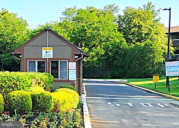5026 North Convent Lane, Unit J Philadelphia, PA 19114 - Photo 23 of 41 a front view of house with yard and green space