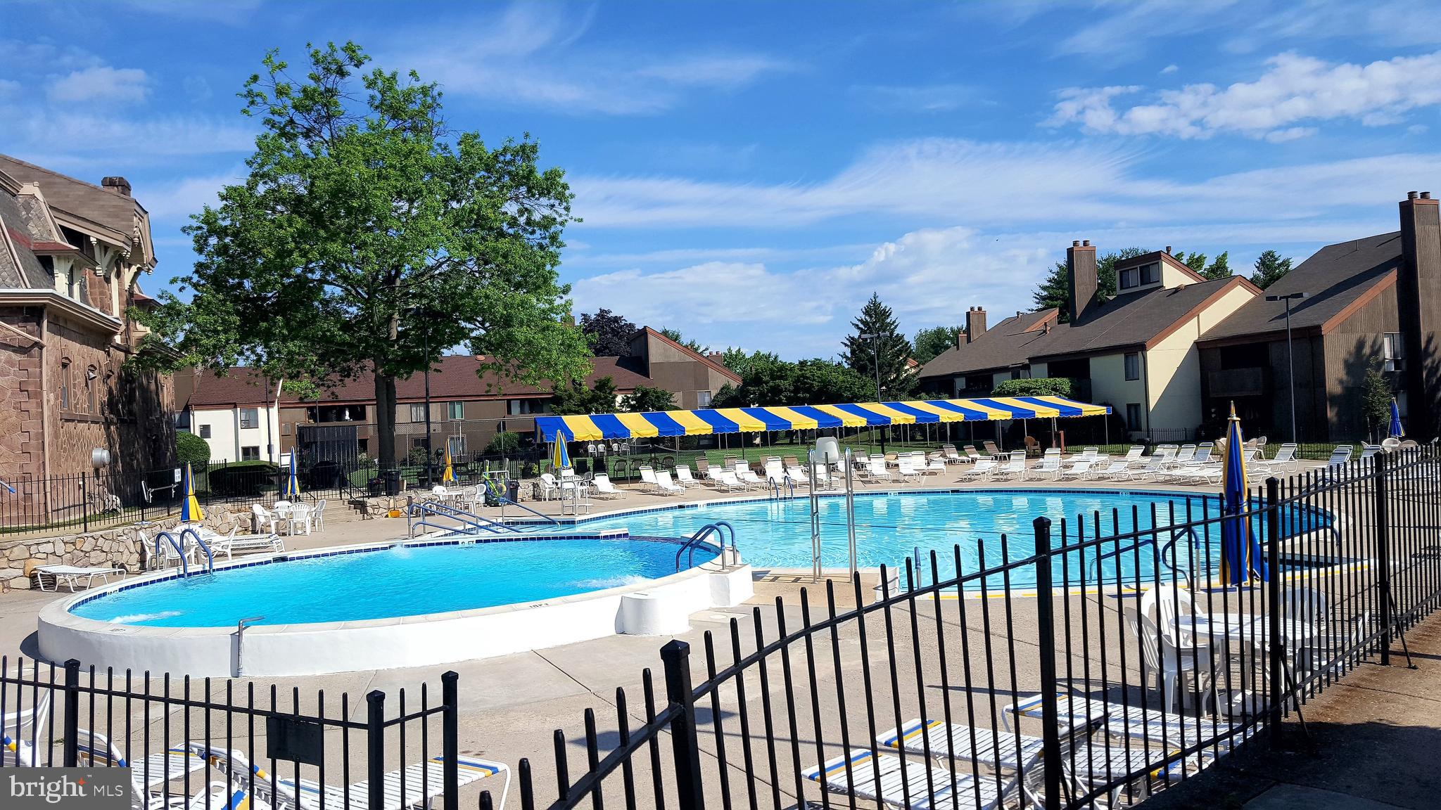 5026 North Convent Lane, Unit J Philadelphia, PA 19114 - Photo 26 of 41 a view of a swimming pool with an outdoor seating