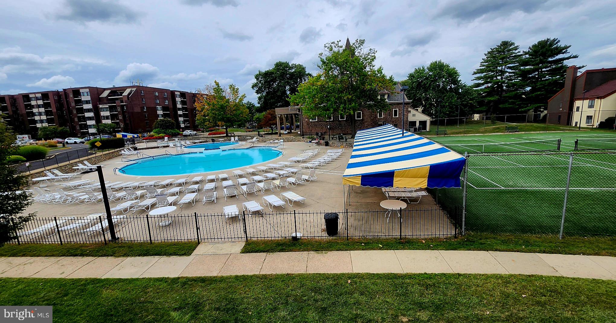 5026 North Convent Lane, Unit J Philadelphia, PA 19114 - Photo 4 of 41 a view of a swimming pool with a patio