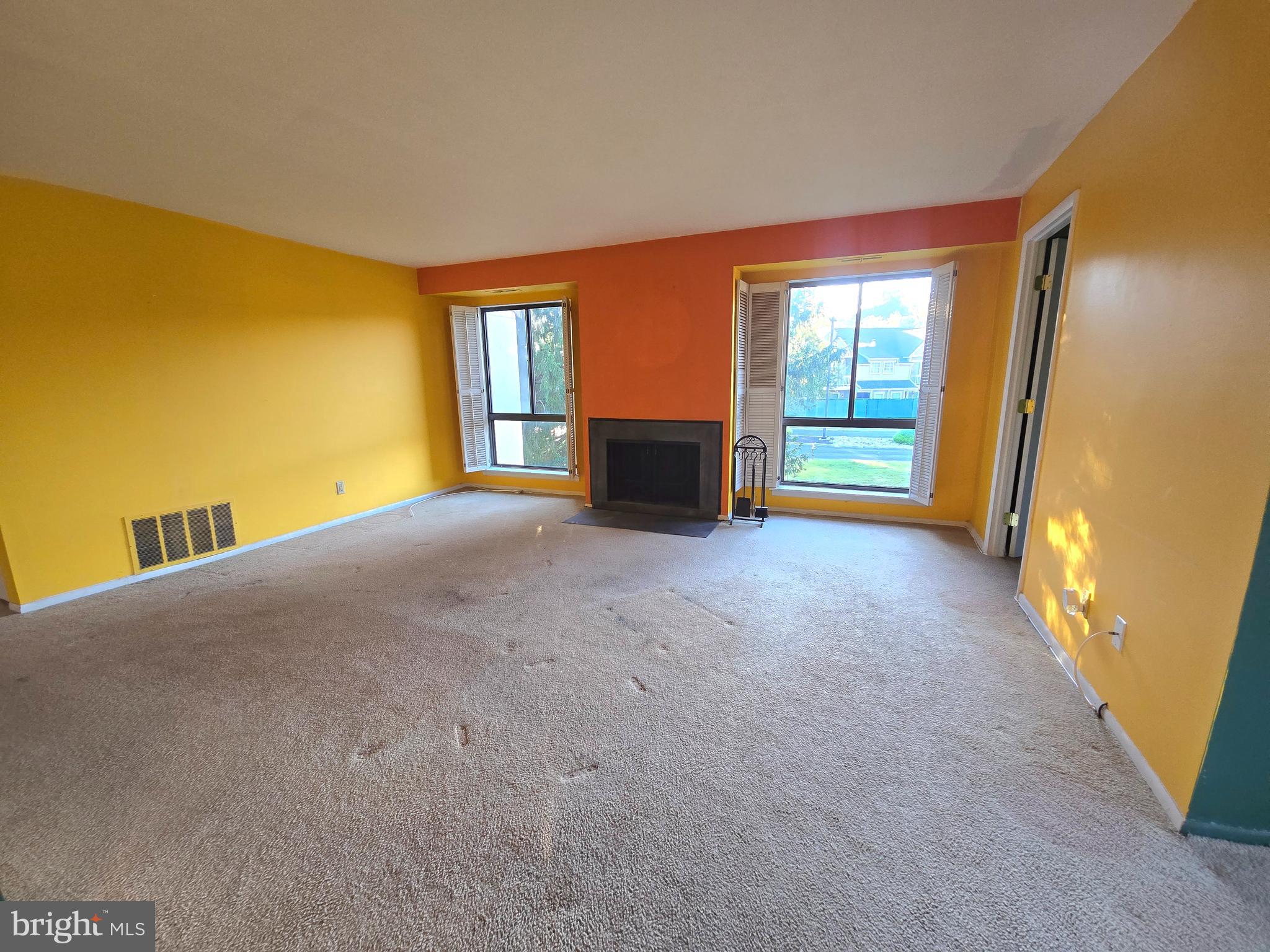5026 North Convent Lane, Unit J Philadelphia, PA 19114 - Photo 5 of 41 a view of empty room with a fireplace