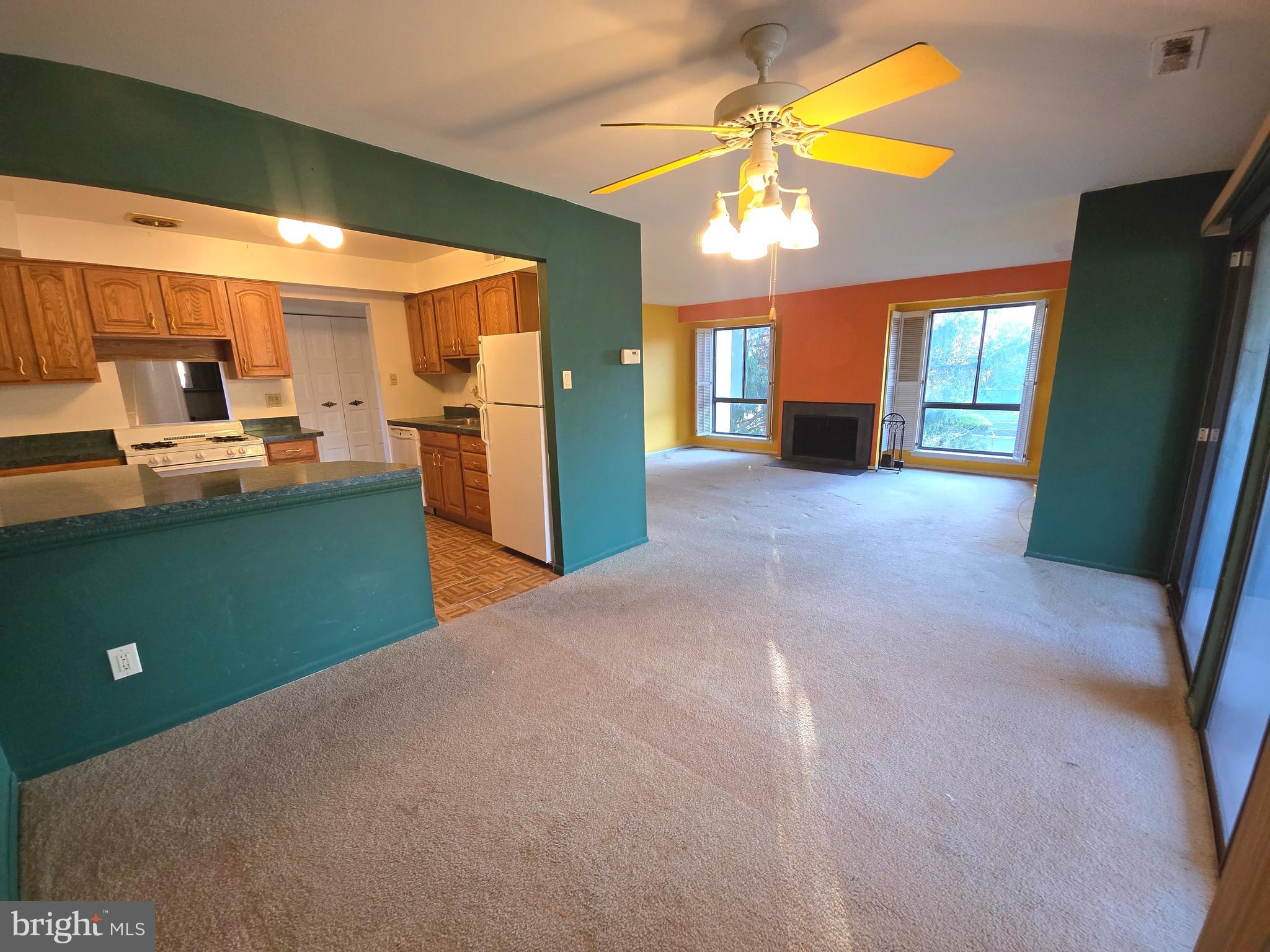 5026 North Convent Lane, Unit J Philadelphia, PA 19114 - Photo 10 of 41 a view of a kitchen with a sink and a refrigerator