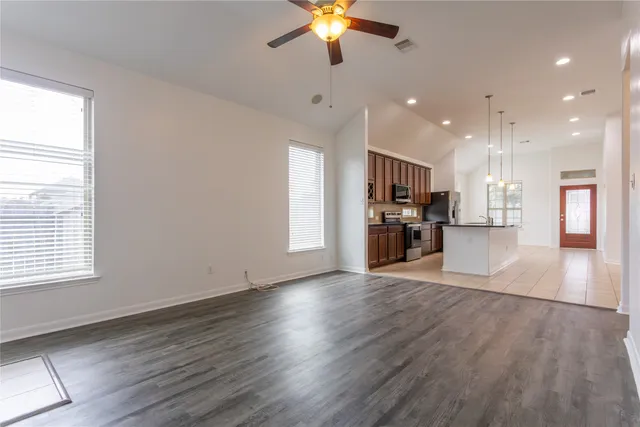 a view of kitchen with cabinets and wooden floor