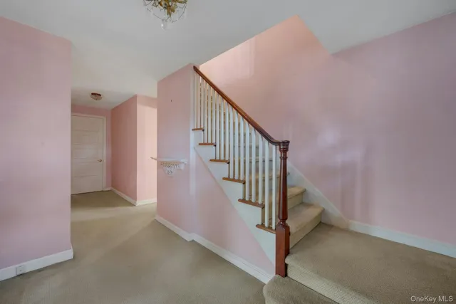 a view of a hallway with staircase
