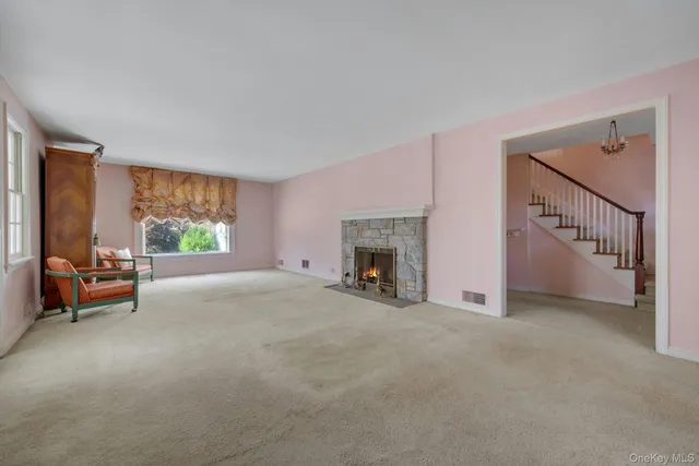 a view of a livingroom with furniture and a fireplace