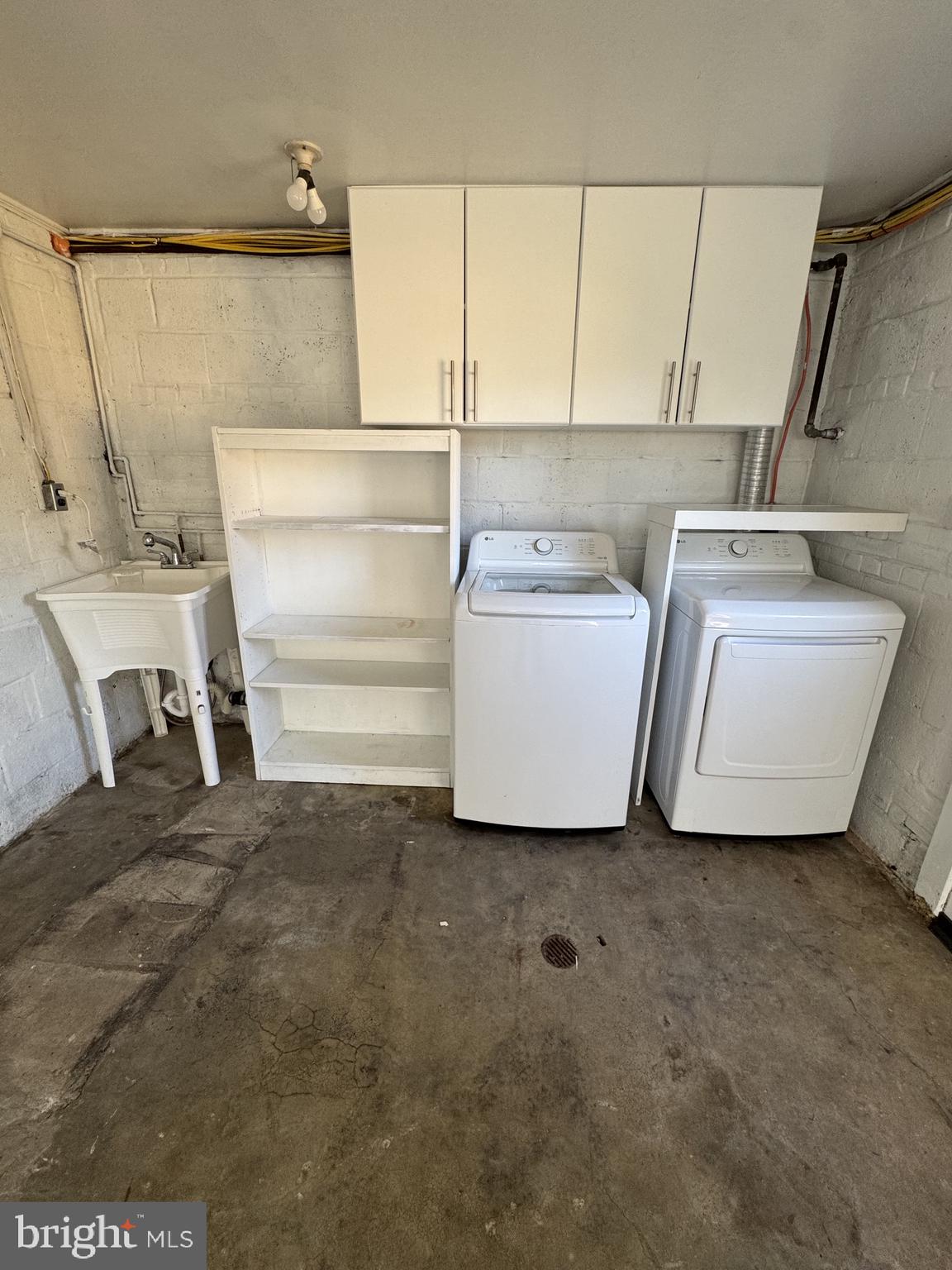 7410 Dickenson Street Springfield, VA 22150 - Photo 12 of 14 Functional laundry space with storage.