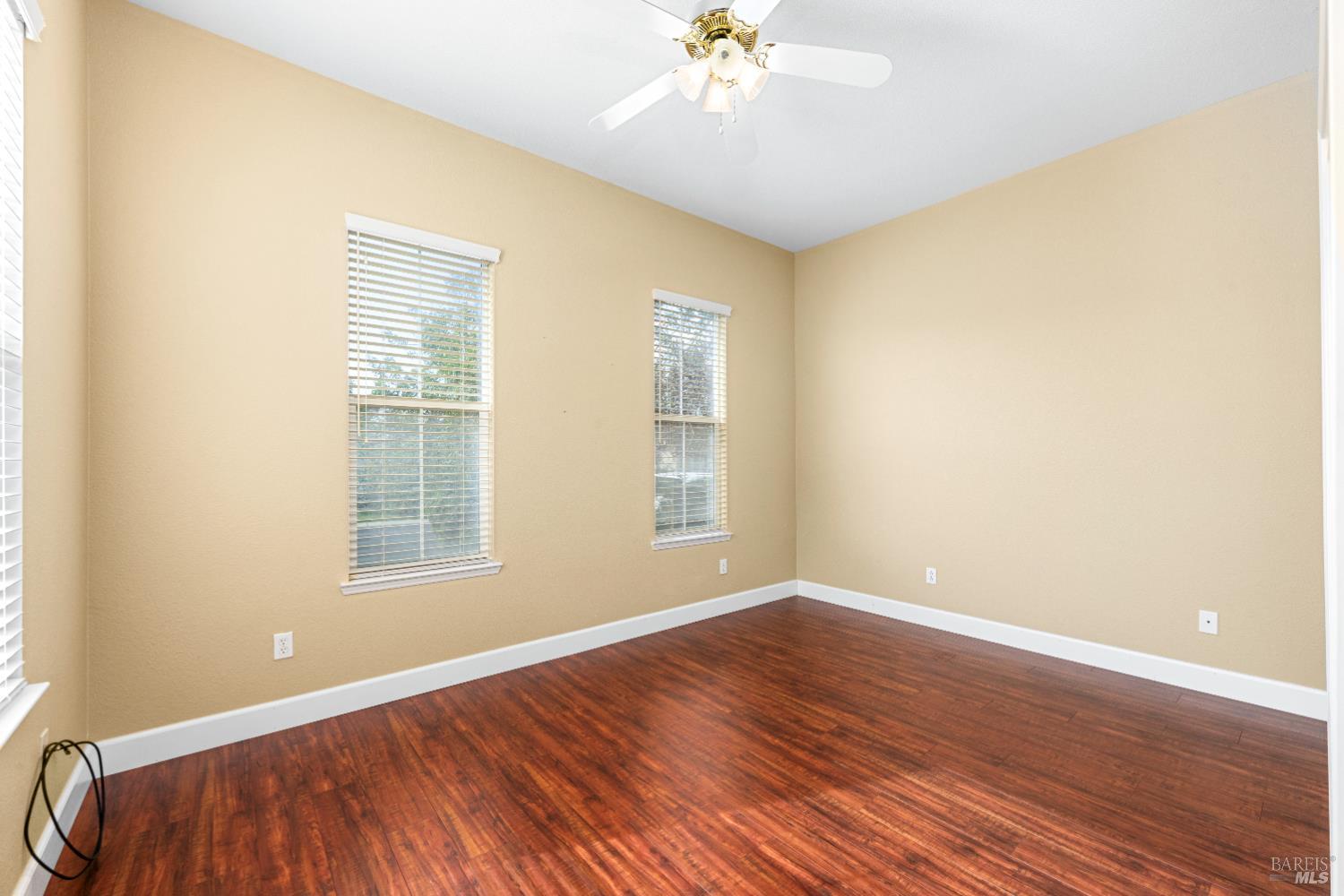 210 Southern Hills Drive Rio Vista, CA 94571 - Photo 11 of 52 a view of an empty room with wooden floor and a window