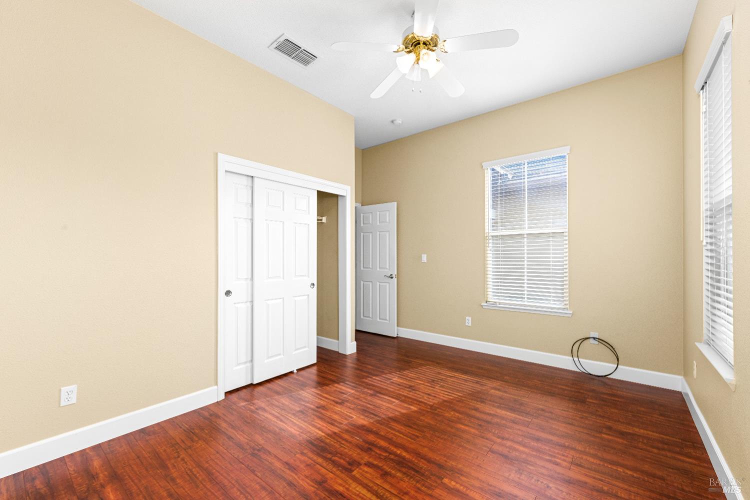 210 Southern Hills Drive Rio Vista, CA 94571 - Photo 12 of 52 a view of an empty room with a window and wooden floor