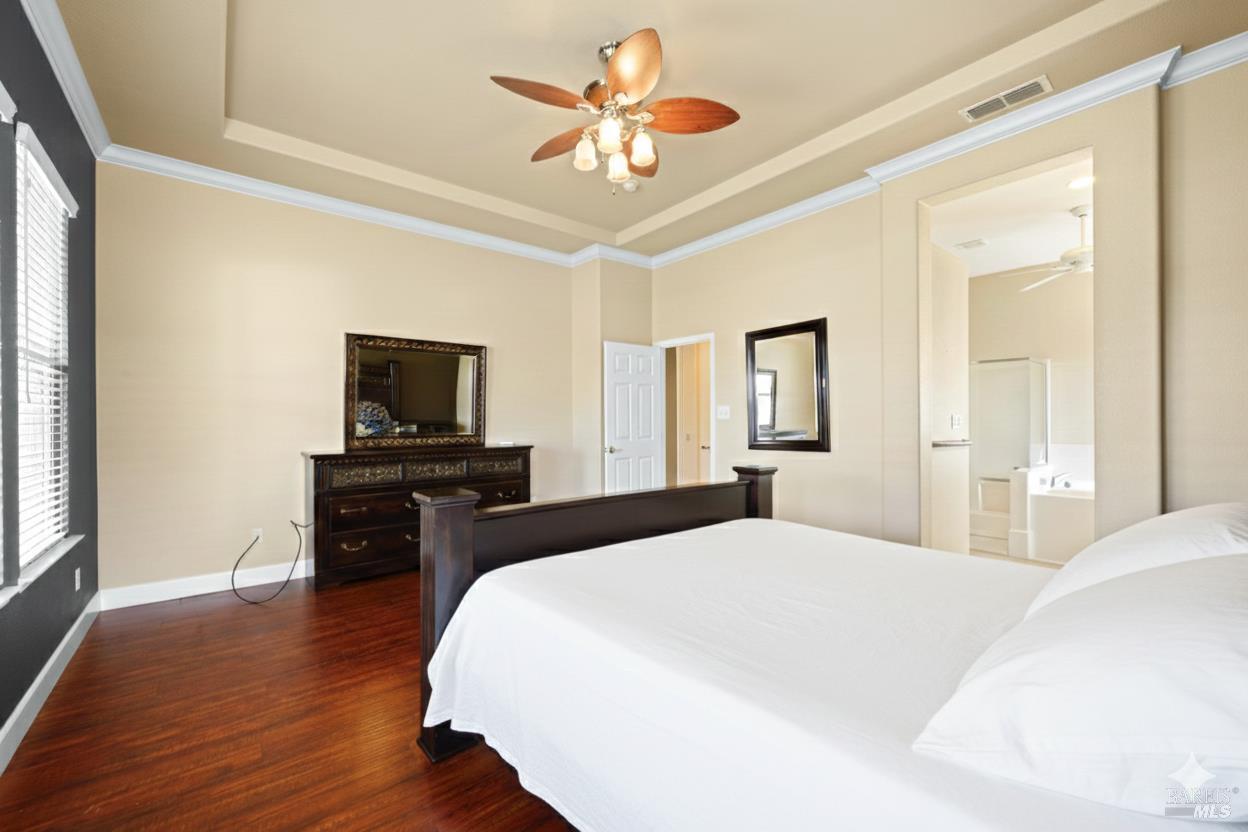 210 Southern Hills Drive Rio Vista, CA 94571 - Photo 14 of 52 a bedroom with a bed and a flat screen tv