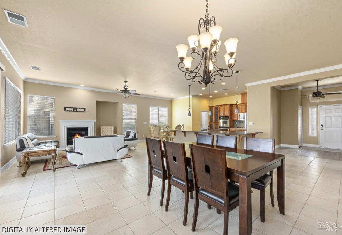 210 Southern Hills Drive Rio Vista, CA 94571 - Photo 19 of 52 a view of a dining room with furniture wooden floor and chandelier