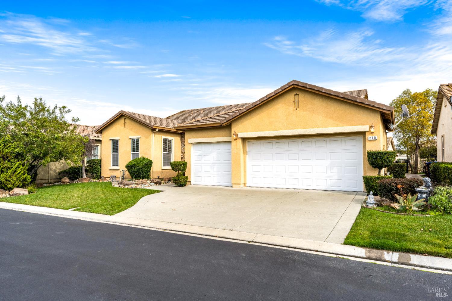 210 Southern Hills Drive Rio Vista, CA 94571 - Photo 3 of 52 a view of a house with a yard and garage