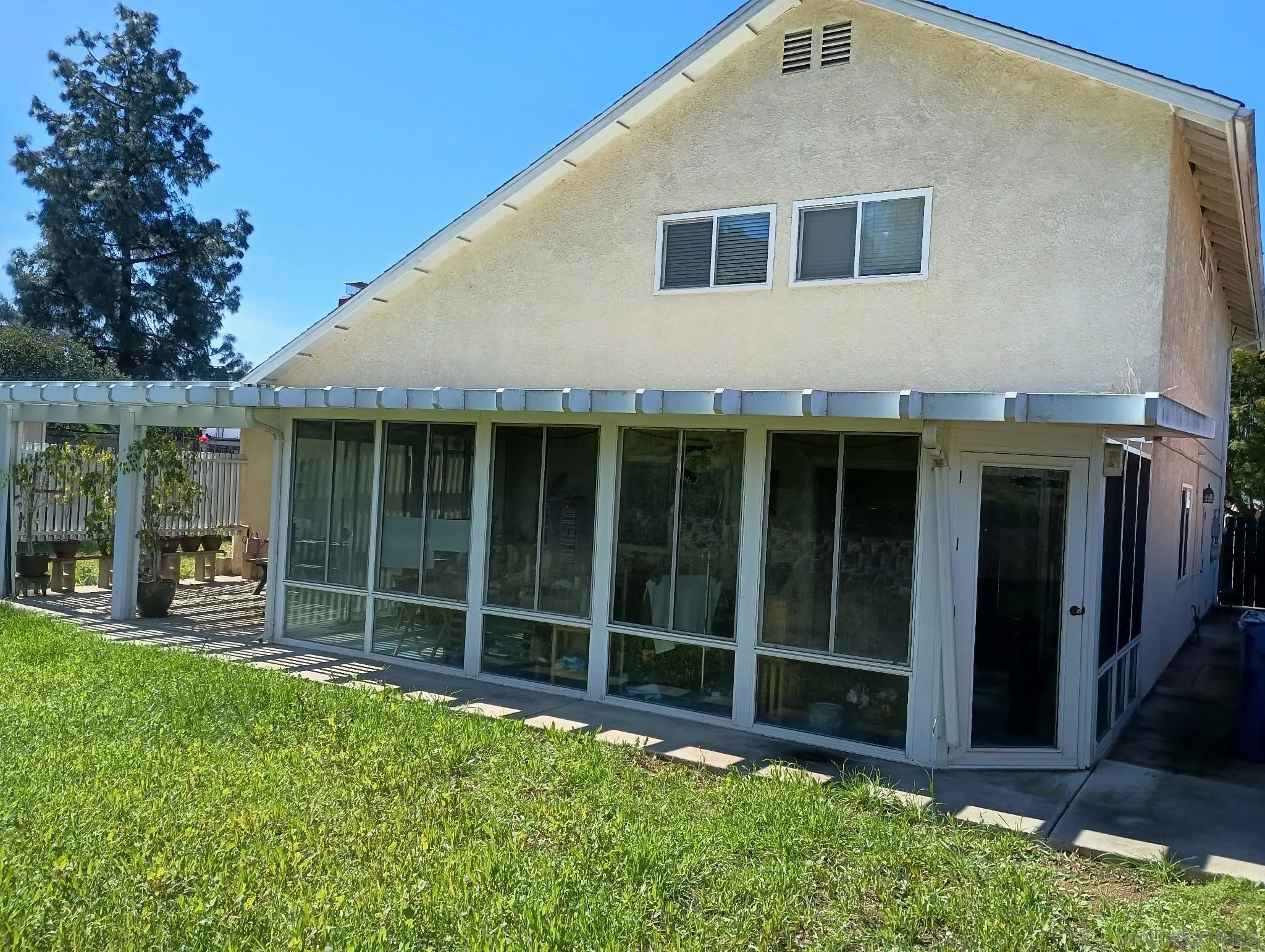 10945 Grand Fork Drive Santee, CA 92071 - Photo 3 of 4 a view of backyard with large trees and a barn