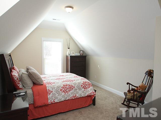 4429 Glengrove Road Raleigh, NC 27616 - Photo 11 of 13 a bedroom with a bed and chair