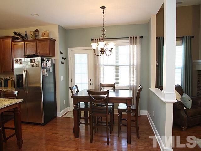 4429 Glengrove Road Raleigh, NC 27616 - Photo 6 of 13 a view of a dining room with furniture window and wooden floor