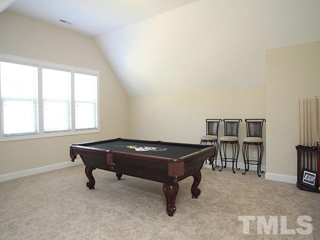 4429 Glengrove Road Raleigh, NC 27616 - Photo 9 of 13 a living room with furniture a table and a large window