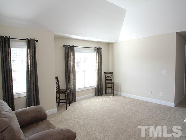 4429 Glengrove Road Raleigh, NC 27616 - Photo 10 of 13 a living room with furniture and a window