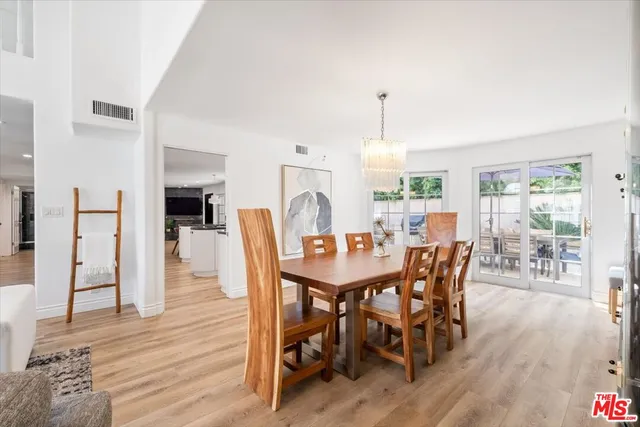 a kitchen with stainless steel appliances granite countertop a sink and a stove