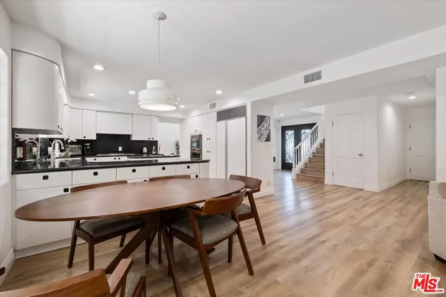 a kitchen with a table and chairs in it