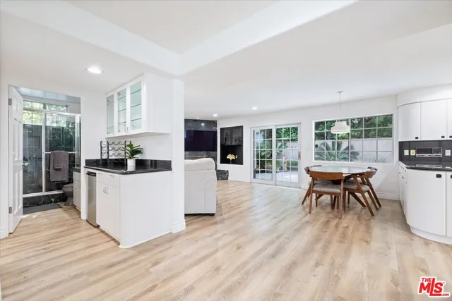 a bedroom with a large bed and a large window