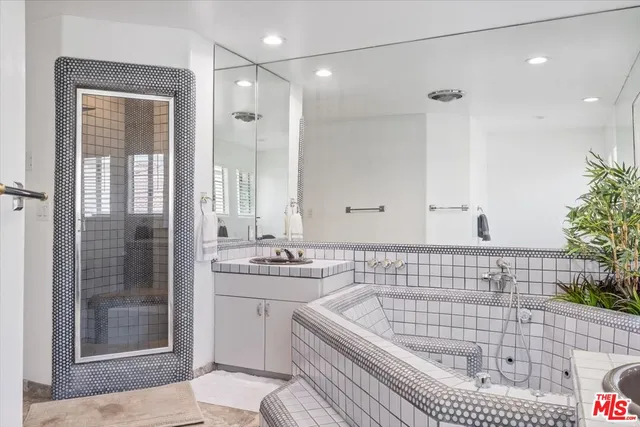 a bathroom with a toilet a sink and shower